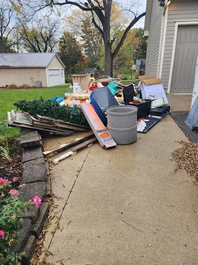 Dumpster being loaded with debris for Residential Dumpster Rental in Durand